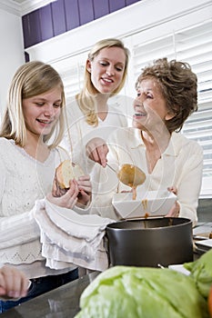 Three generation family at home serving lunch