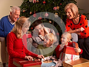 Three Generation Family Opening Christmas Gifts