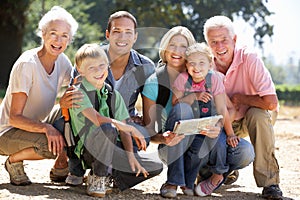 Three generation family walking in country