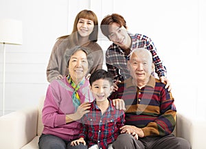 Three generations asian family on sofa