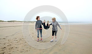 Three generations female walking on the beach