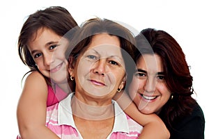 Three generations of latin women isolated on white