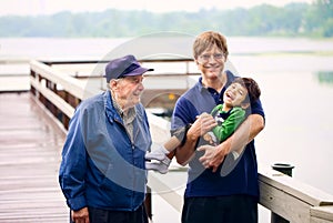 Three generations of males interacting together