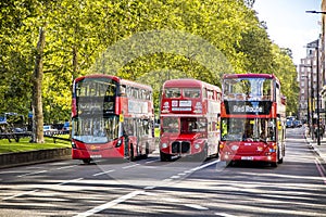 Three generations of red London buses