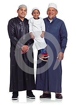 Three generations of smiles. Studio portrait of the male members of a muslim family isolated on white.