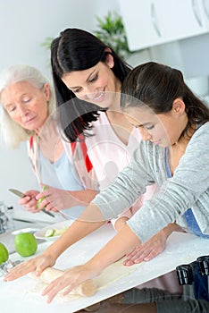Three generations women baking together