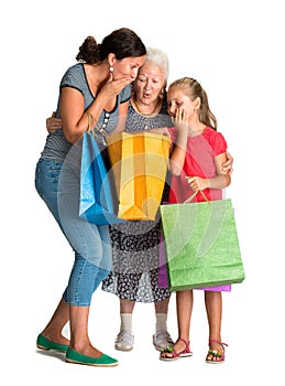 Three generations of women with shopping bags