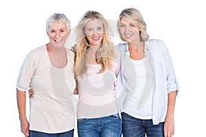 Three generations of women smiling at camera