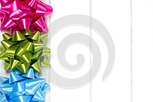 Three gift bows piled