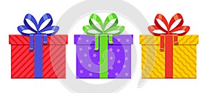 Three Gift Boxes With Different Wrapping Paper and Bow Colors