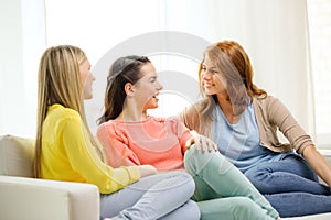 Three girlfriends having a talk at home