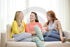 Three girlfriends having a talk at home