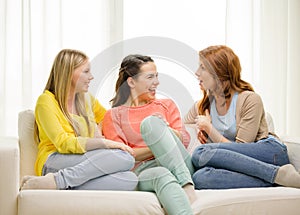 Three girlfriends having a talk at home