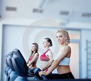 Three girls in fitness center