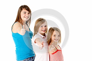 Three Girls Giving Thumbs Up Gesture In Studio