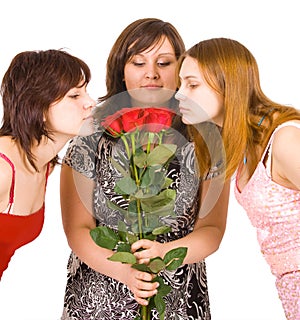 Three girls group smell roses