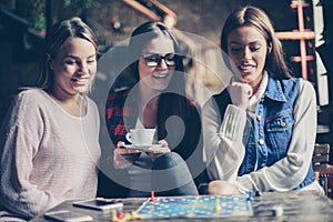 Three girls having fun and playing game.