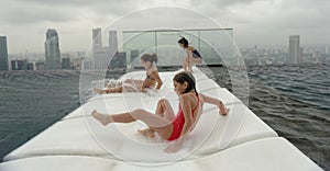 Three girls having fun at the swimming pool