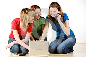 Three girls with a laptop