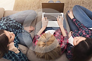 Three girls with laptop computer top view