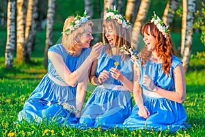 Three girls on the lawn in equally clothes