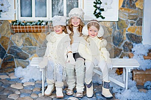 Three girls near a Christmas