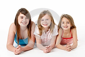 Three Girls Piled Up In Pyramid In Studio