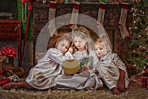 Three Girls Reading Christmas Story Book