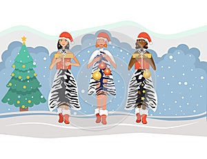 Three girls are ready for the New Year, Christmas. Multinational girls in Santa hats and tiger print dresses