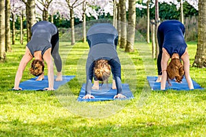 Three girls standing in a basic yoga pose