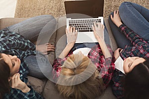 Three girls with laptop computer top view