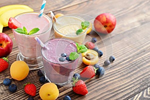 Three glass of fruit milkshakes