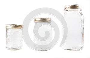 Three glass mason jars on an isolated background