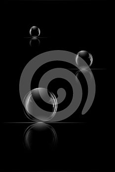 Three glass spheres on a black background