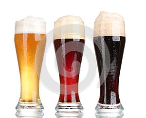 Three glasses with different beers