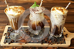 Three glasses of different cold coffee drinks.