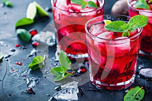 Three Glasses of Red Liquid With Mint Garnish