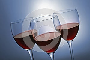 Three glasses with red wine