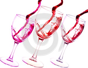 Three glasses of red wine abstract splash isolated on white