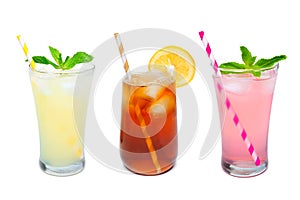 Three glasses of summer drinks with straws over white