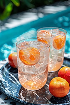 Three Glasses of Water With Oranges on a Plate