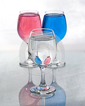 Three glasses of water showing reflections with distortions