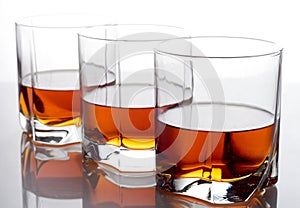 Three glasses of whiskey