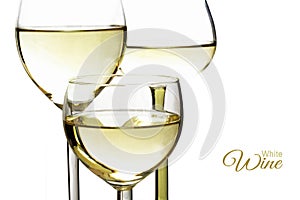 Three glasses with white wine, closeup, isolated against a white