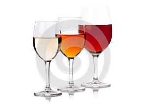 Three glasses with wine of different colour