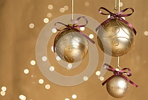 Three gold Christmas balls