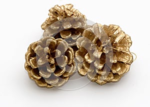 Three gold pine cones