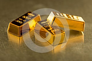 Three golden bars on metal