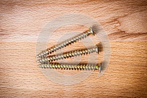 Three goldish screws photo