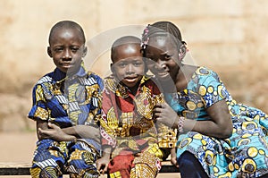 Three gorgeous African black ethnicity children posing outdoors